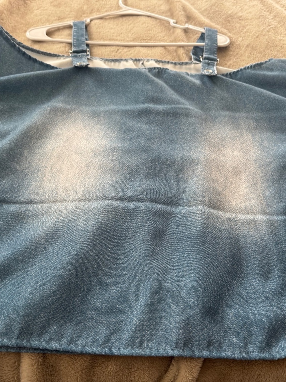 Off the  shoulder neckline and adjustable buckle straps, this off-shoulder denim